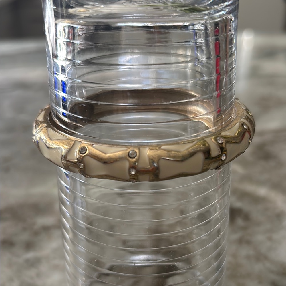 Gold bangle with cream enamel and clear gem accents
